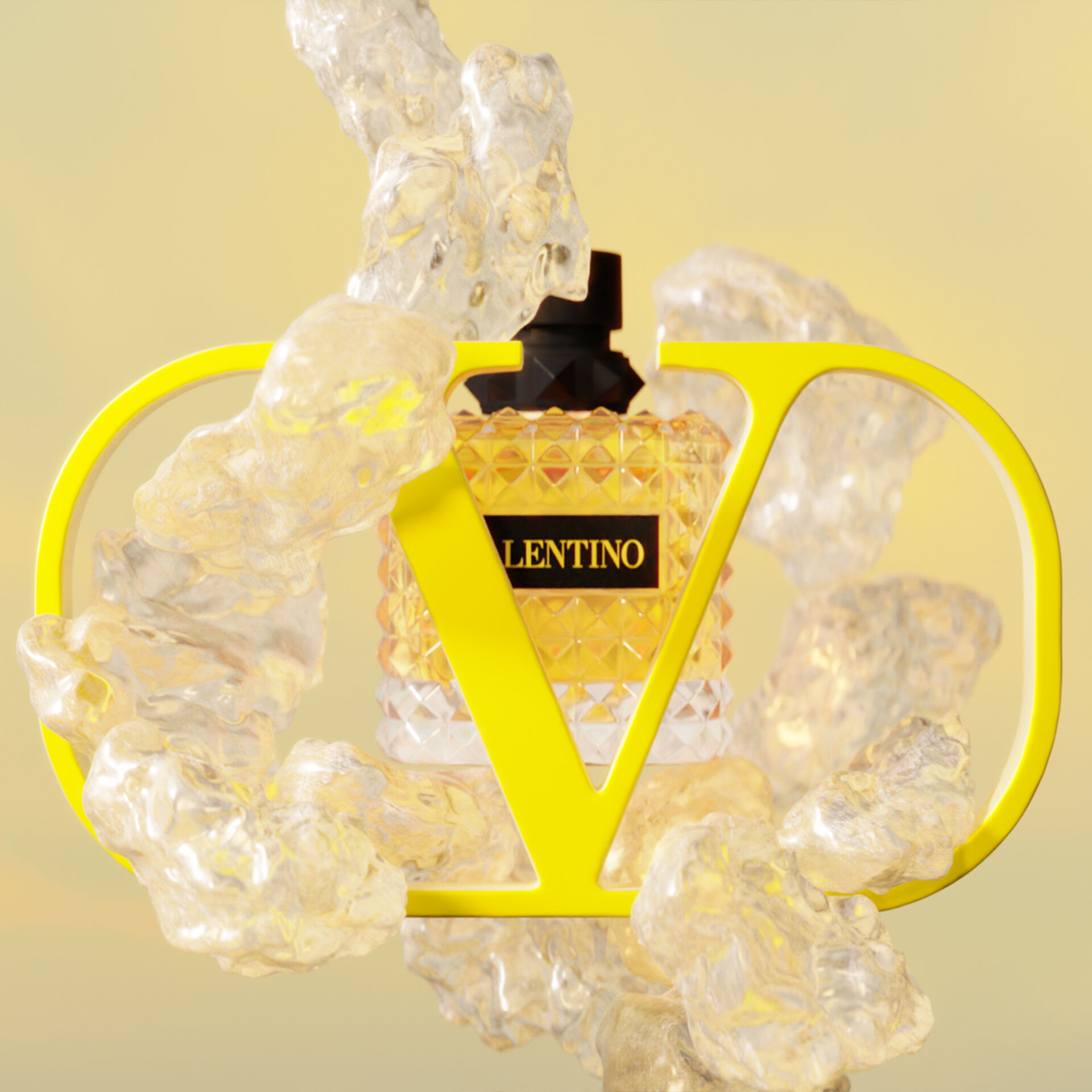 A perfume bottle with a diamond-patterned design sits behind a large yellow "V" and "D" logo, surrounded by translucent, bubbly elements, all set against a soft yellow background.